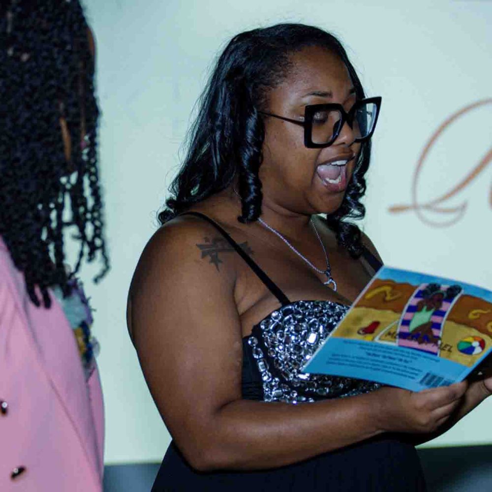 CC Reading Melanin Mel to young folks